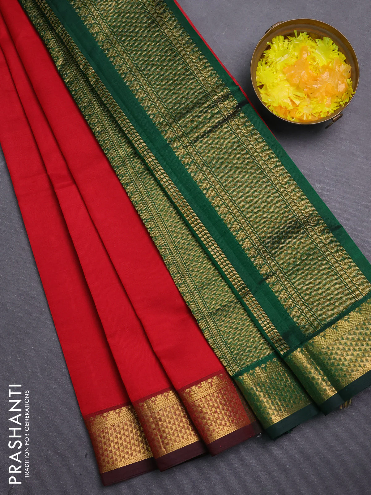 Silk cotton saree red and green with plain body and zari woven border