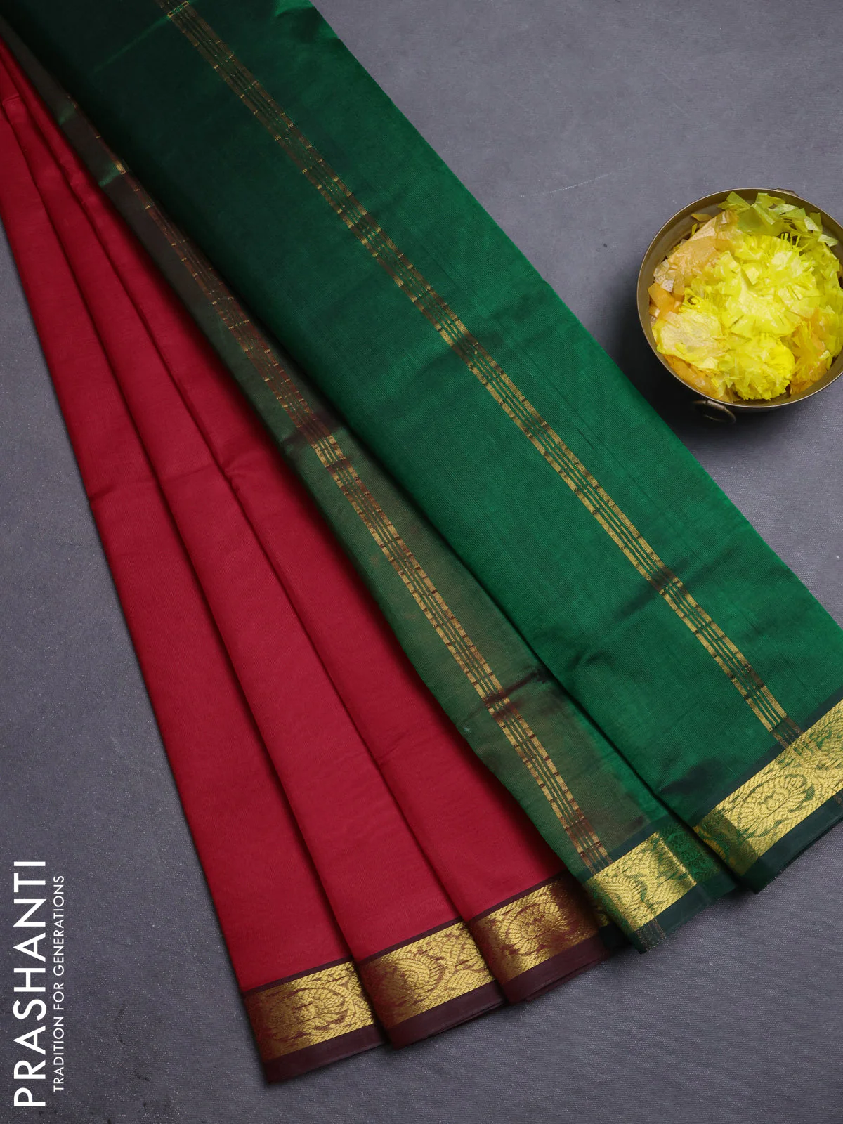 Silk cotton saree red and green with plain body and zari woven border