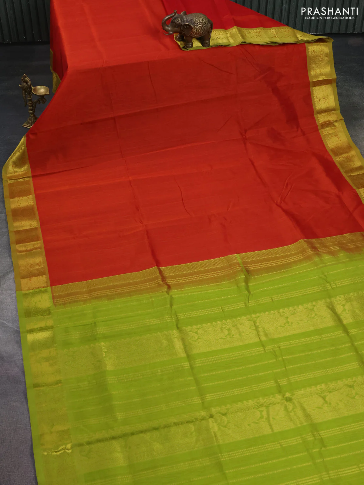 Silk cotton saree red and light green with plain body and zari woven border - Image 2