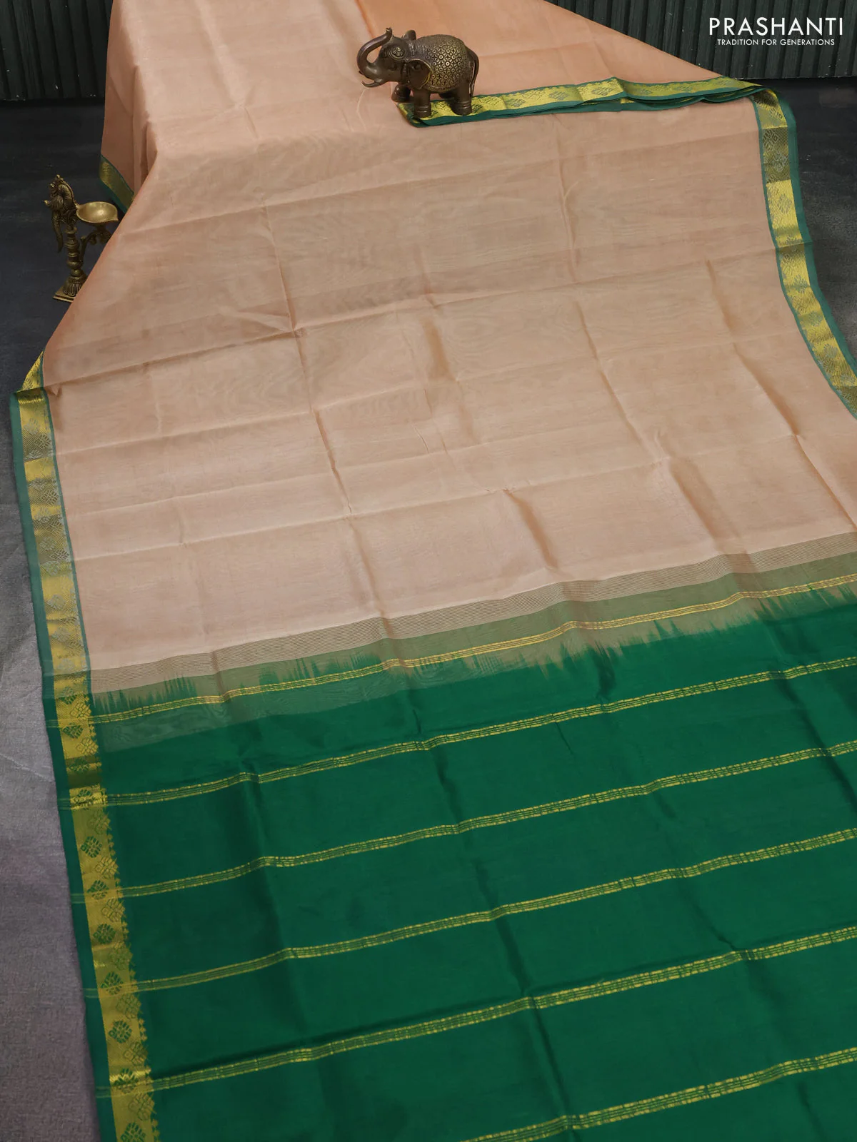 Silk cotton saree sandal and green with plain body and zari woven border - Image 2