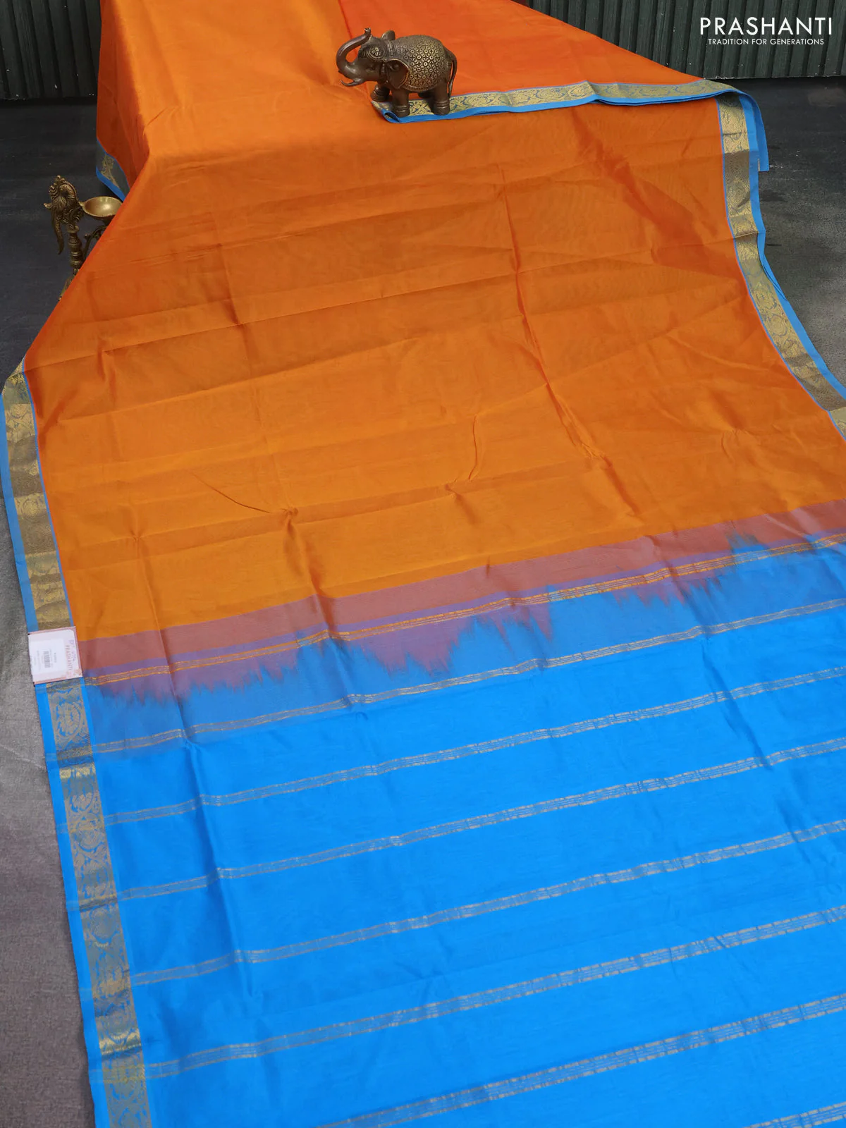Silk cotton saree sunset orange and cs blue with plain body and zari woven border - Image 2