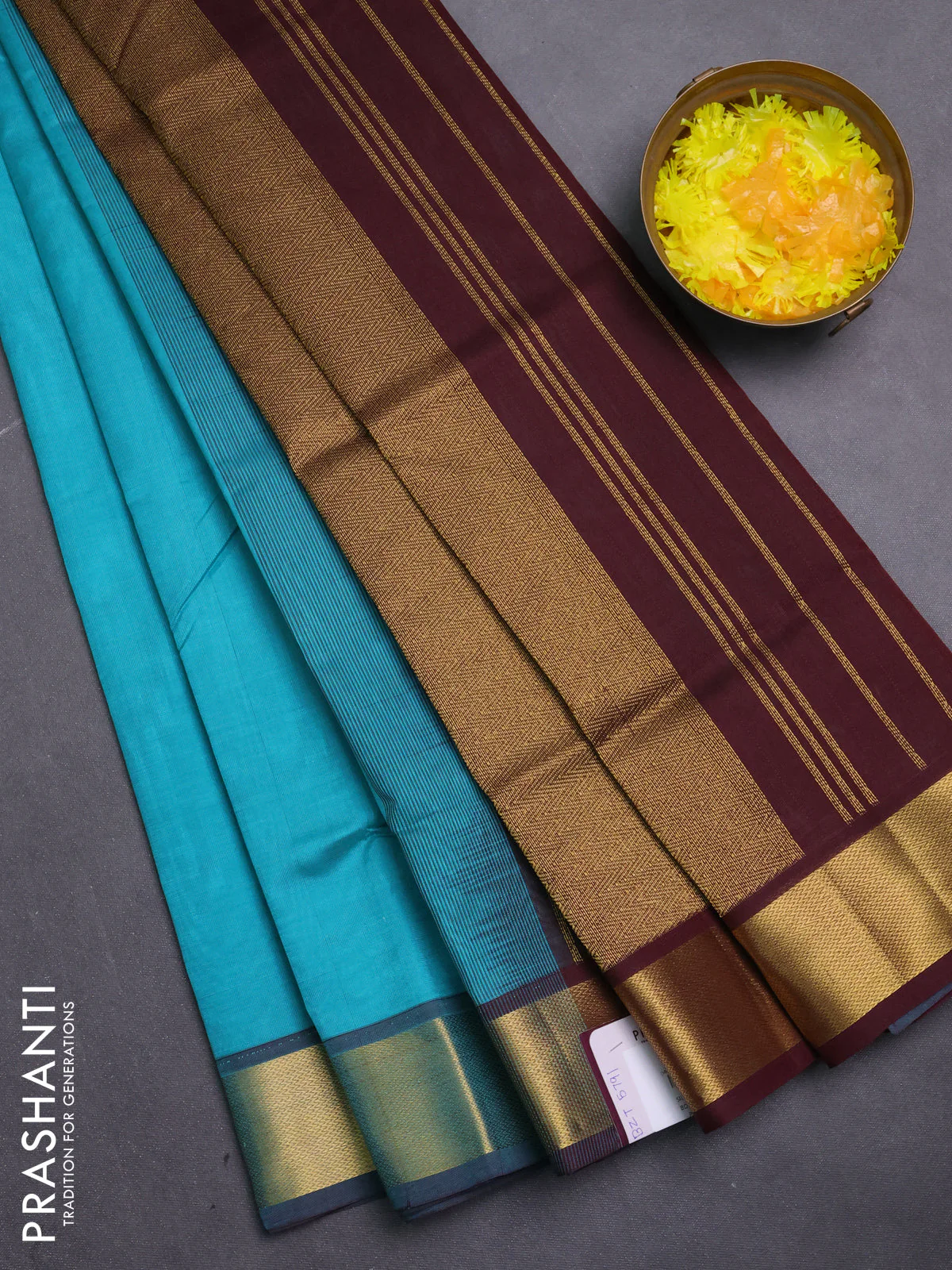 Silk cotton saree teal blue and coffee brown with plain body and zari woven border