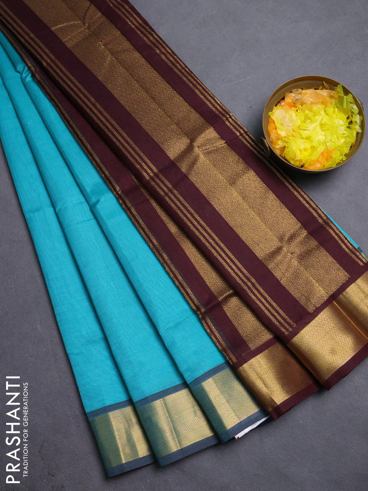 Silk cotton saree teal blue and coffee brown with plain body and zari woven border