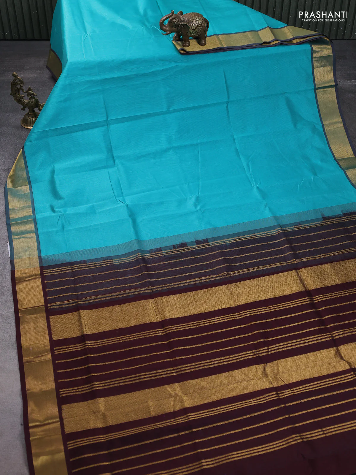 Silk cotton saree teal blue and coffee brown with plain body and zari woven border - Image 2
