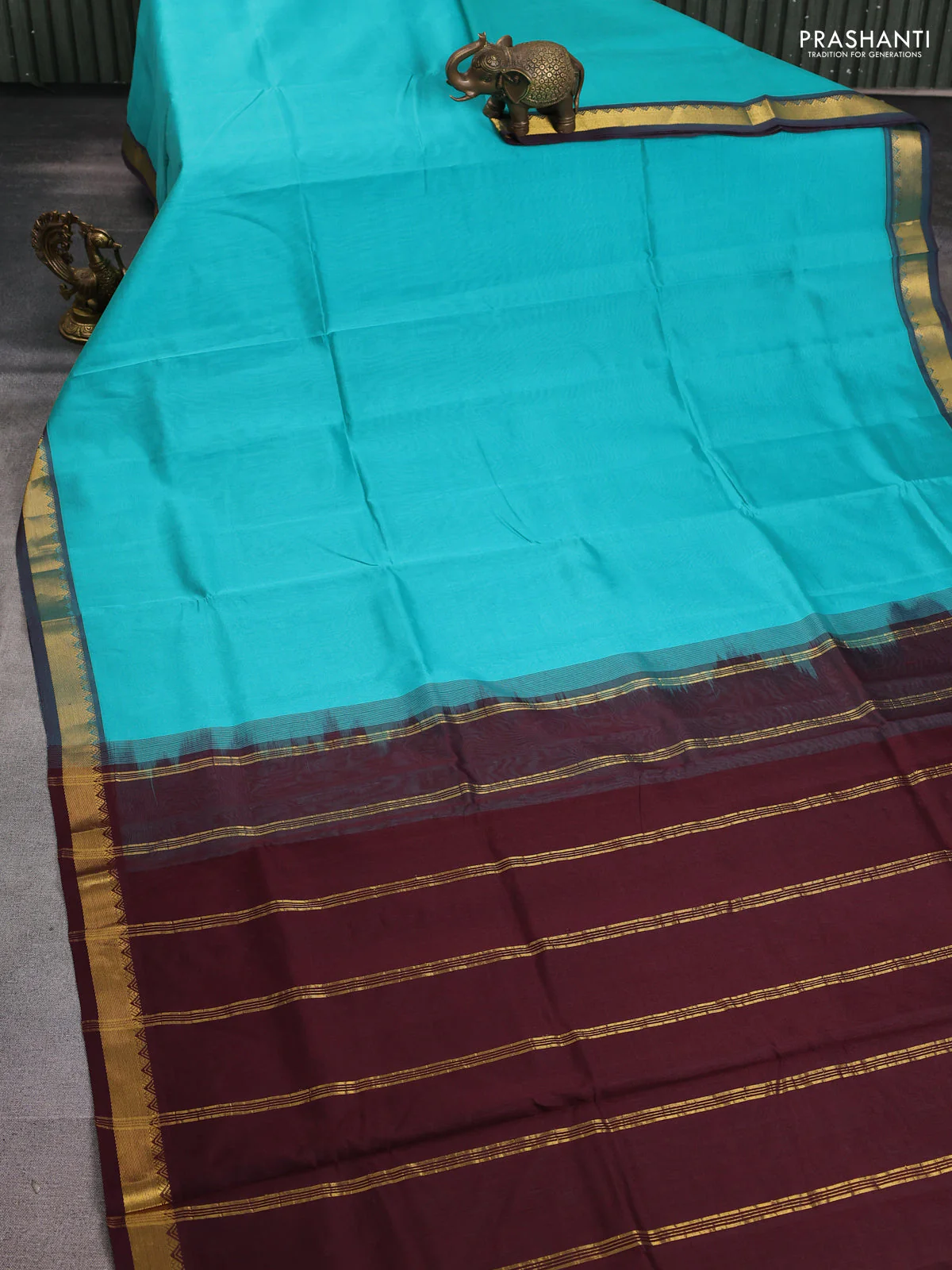 Silk cotton saree teal blue and deep maroon with plain body and zari woven border - Image 2