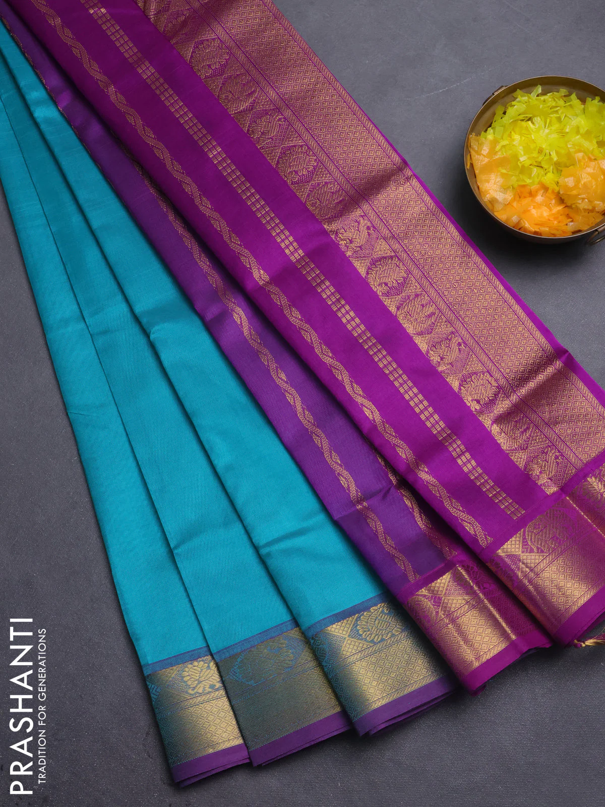 Silk cotton saree teal blue and violet with plain body and zari woven border