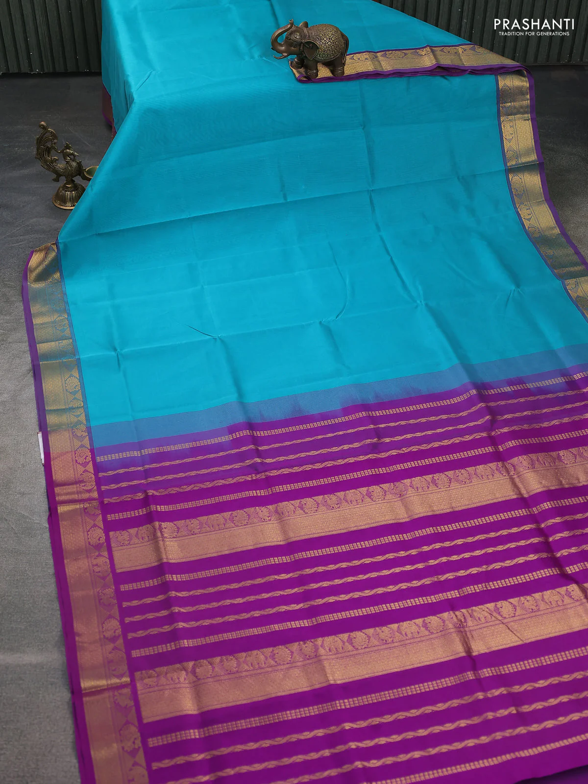 Silk cotton saree teal blue and violet with plain body and zari woven border - Image 2
