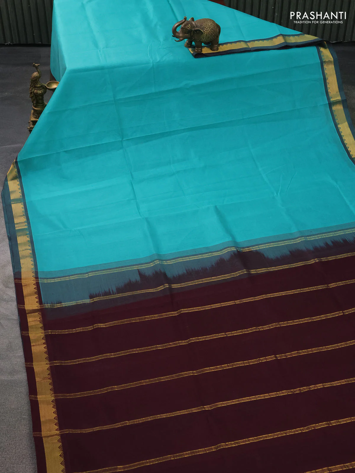 Silk cotton saree teal blue and wine shade with plain body and zari woven border - Image 2