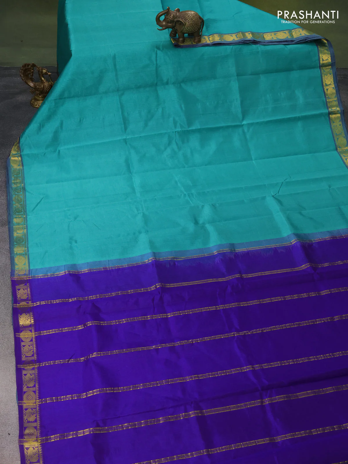 Silk cotton saree teal green and blue with plain body and zari woven border - Image 2