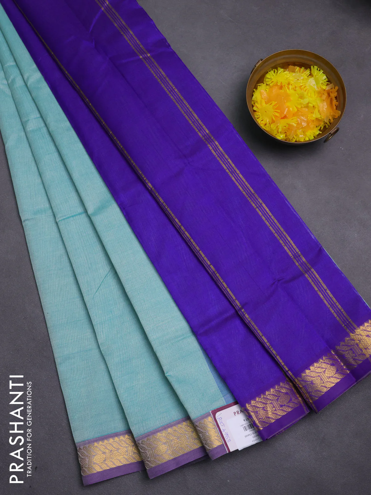 Silk cotton saree teal green and violet with plain body and zari woven border