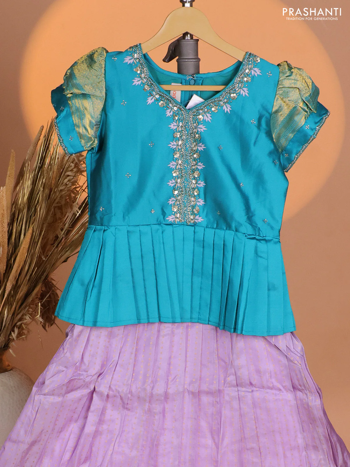 Silk kids lehenga teal blue shade and lavender with aari work neck pattern & puff sleeve and allover zari buttas & zari woven border - Image 2