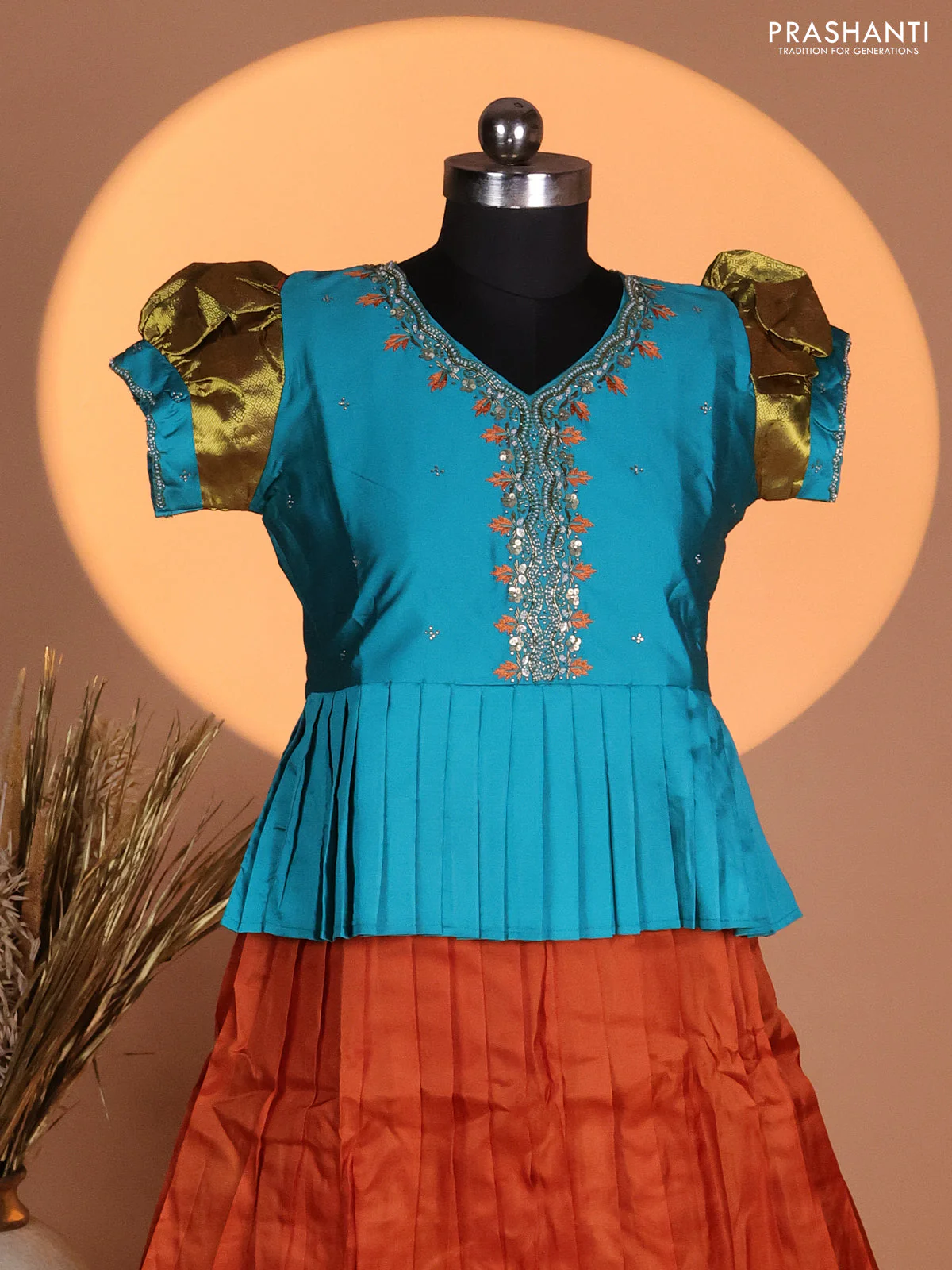 Silk kids lehenga teal blue shade and rust shade with aari work neck pattern & puff sleeve and zari woven border - Image 2