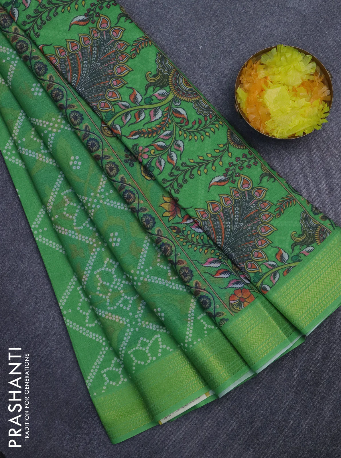 Spun cotton saree light green with allover bandhani prints and zari woven border