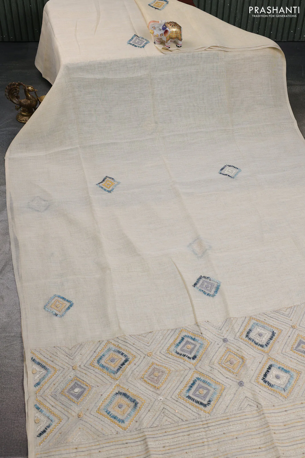 Tissue linen cotton saree cream and sandal with embroidery buttas and embroidery pallu - Image 2