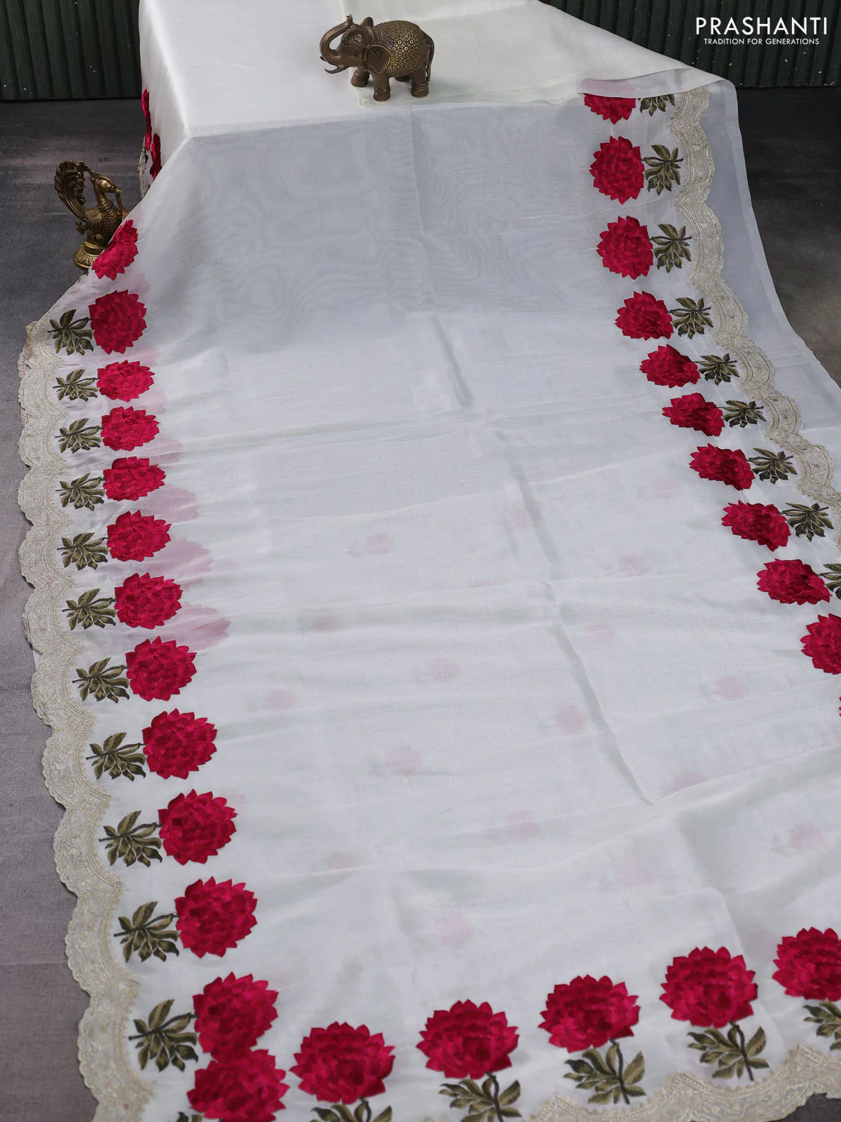 Tissue organza saree cream with plain body and floral embroidery border - Image 2