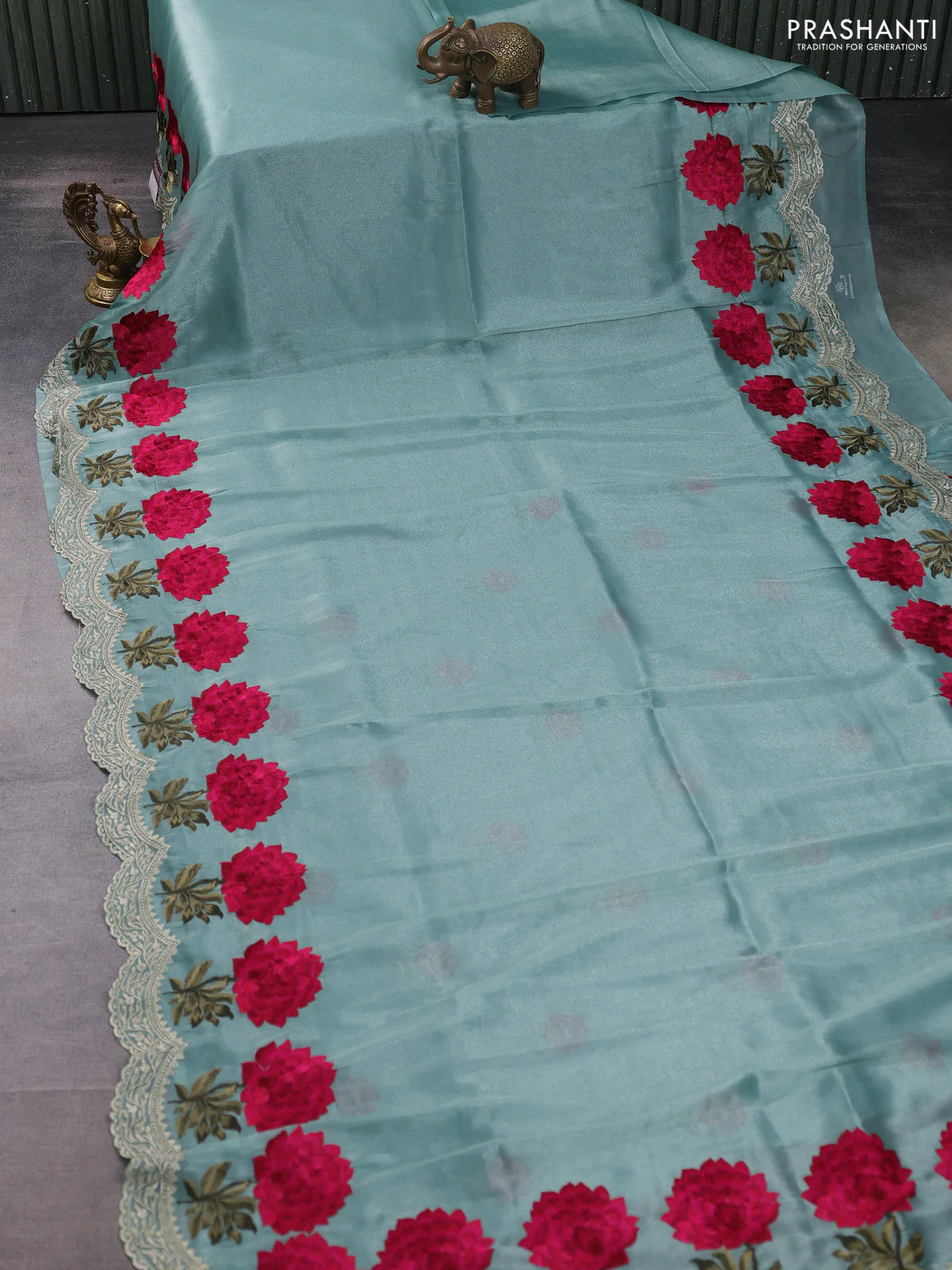 Tissue organza saree pastel green with plain body and floral embroidery border - Image 2