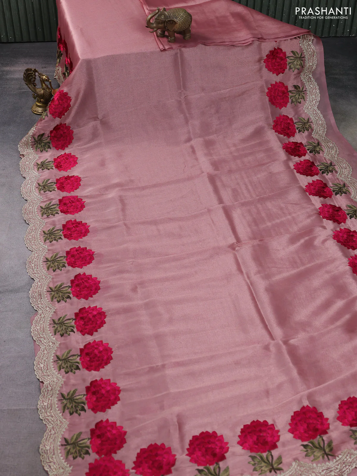 Tissue organza saree pastel peach with plain body and floral embroidery border - Image 2