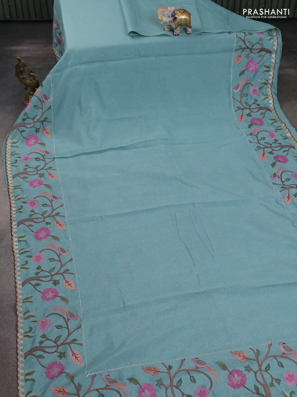 Tissue organza saree teal blue with plain body and embroidery border - Image 2