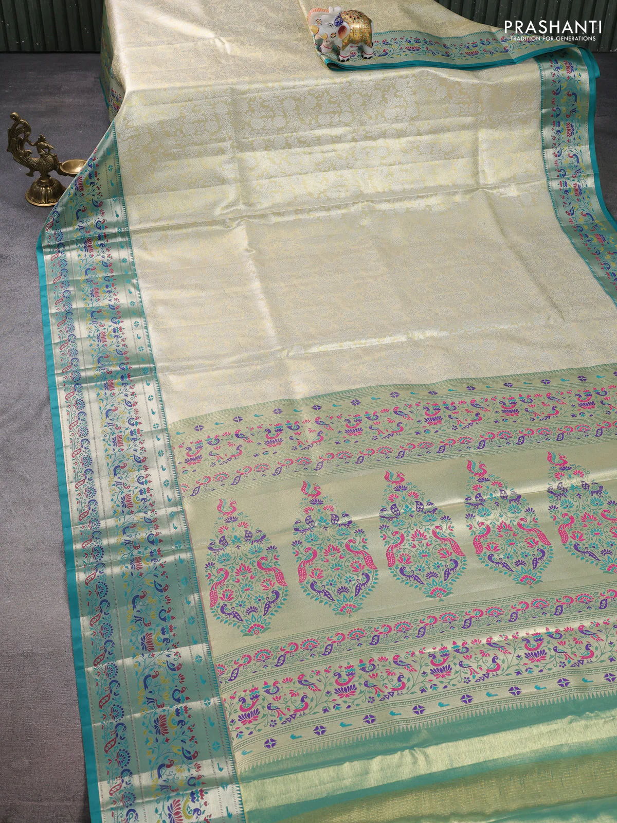 Tissue paithani silk saree cream and teal green with allover silver zari woven brocade weaves and zari woven paithani style border - Image 2
