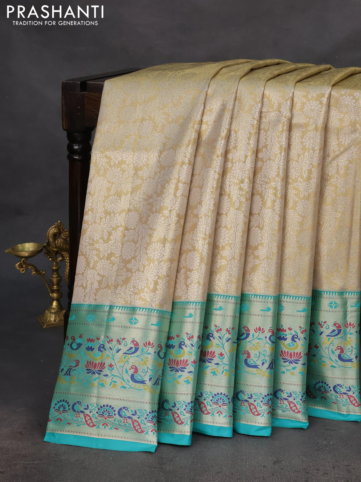 Tissue paithani silk saree cream and teal green with allover silver zari woven brocade weaves and zari woven paithani style border