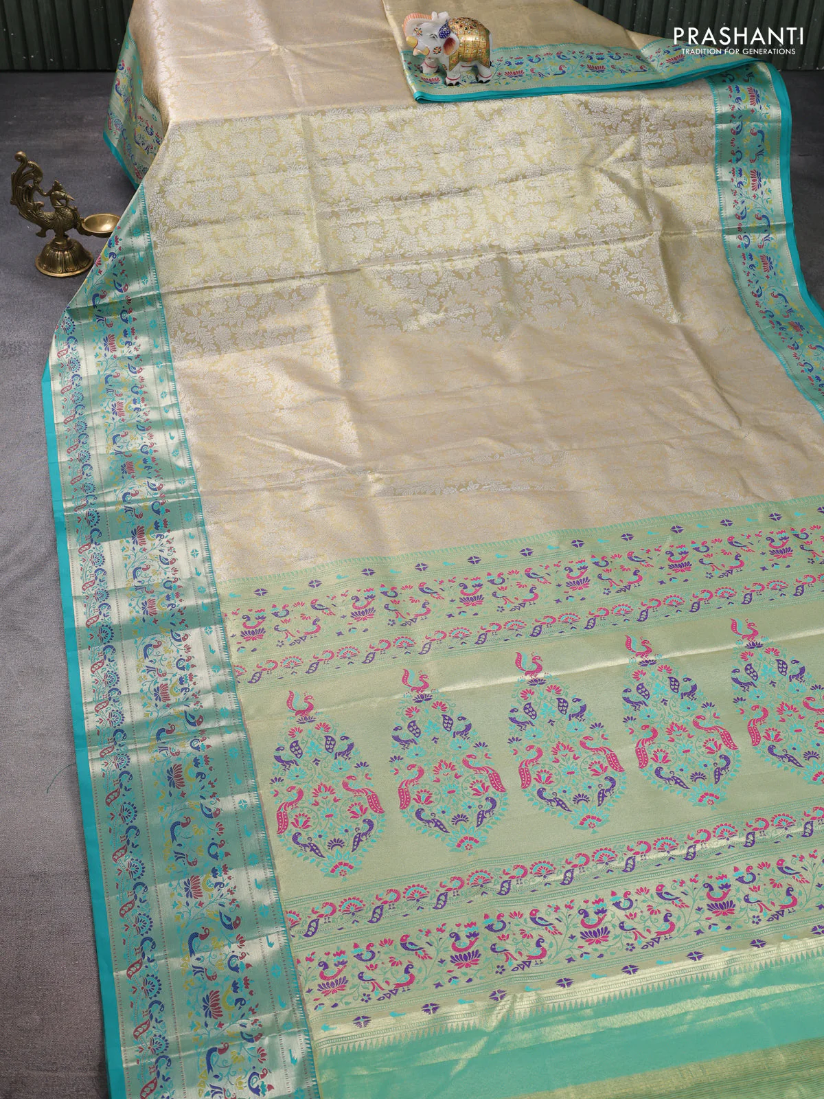Tissue paithani silk saree cream and teal green with allover silver zari woven brocade weaves and zari woven paithani style border - Image 2