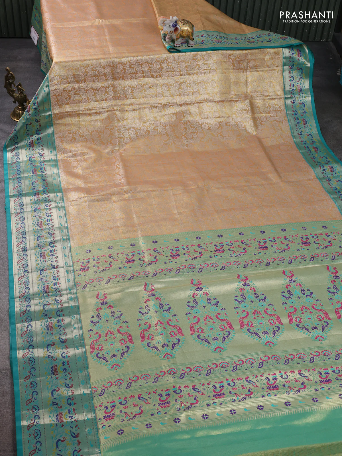 Tissue paithani silk saree dual shade of pale orange and teal blue with allover silver zari woven brocade weaves and zari woven paithani style border - Image 2