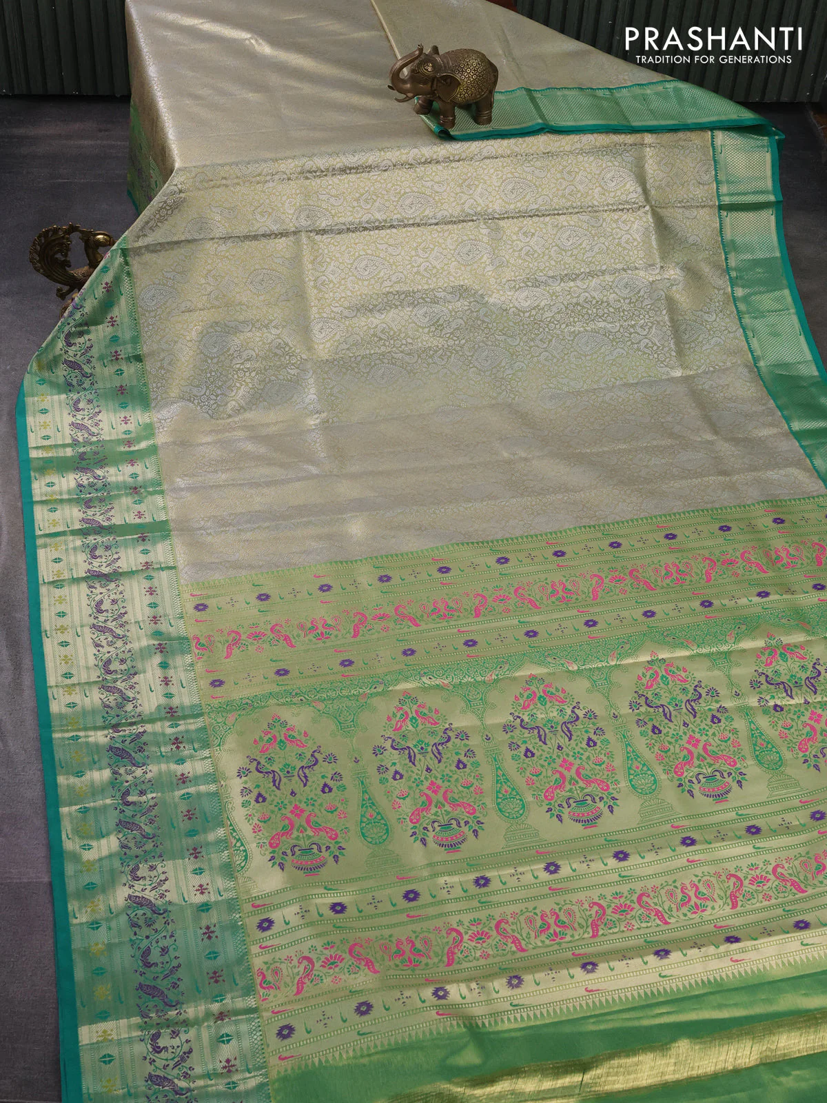 Tissue paithani silk saree dual shade of pastel grey and teal green with allover silver zari woven brocade weaves and zari woven paithani style border - Image 2