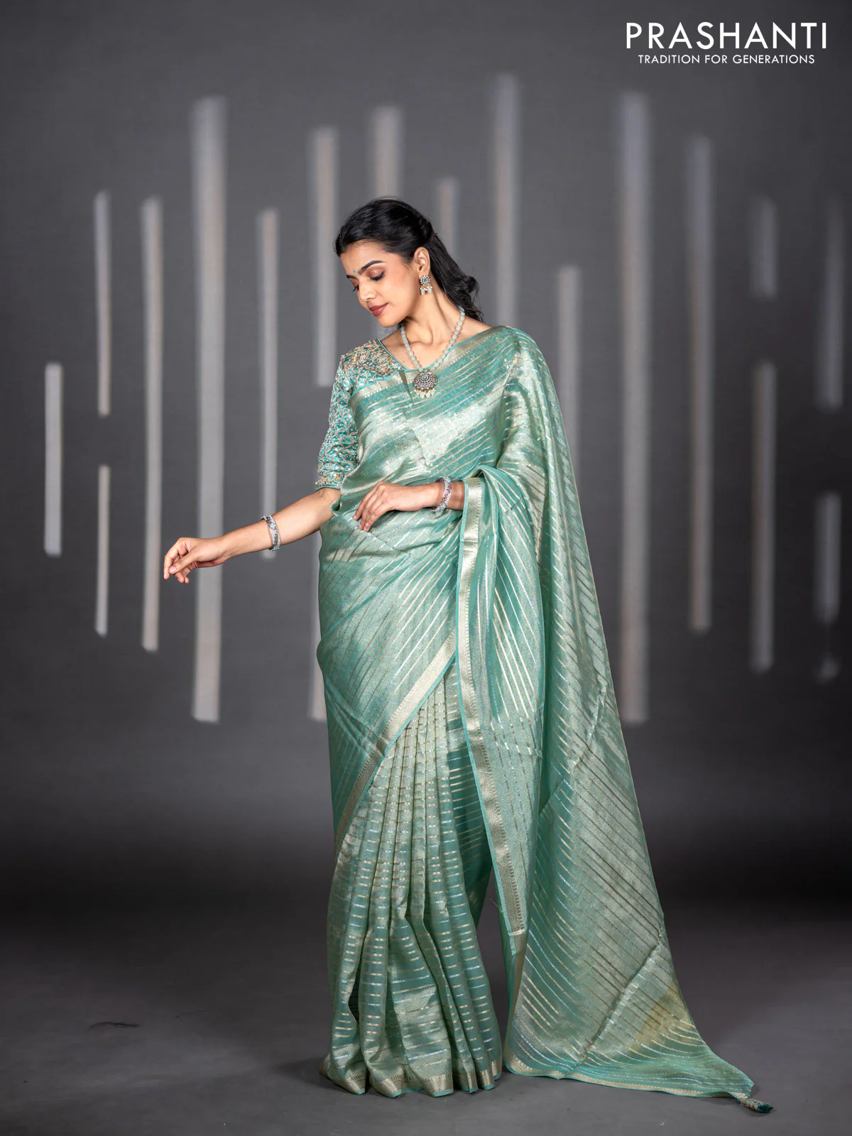 Tissue silk saree teal shade with allover silver & zari weaves and zari woven border - Image 2