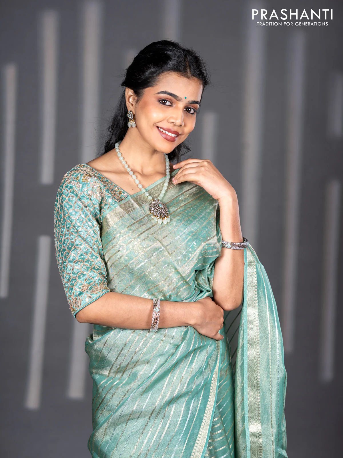 Tissue silk saree teal shade with allover silver & zari weaves and zari woven border - Image 4