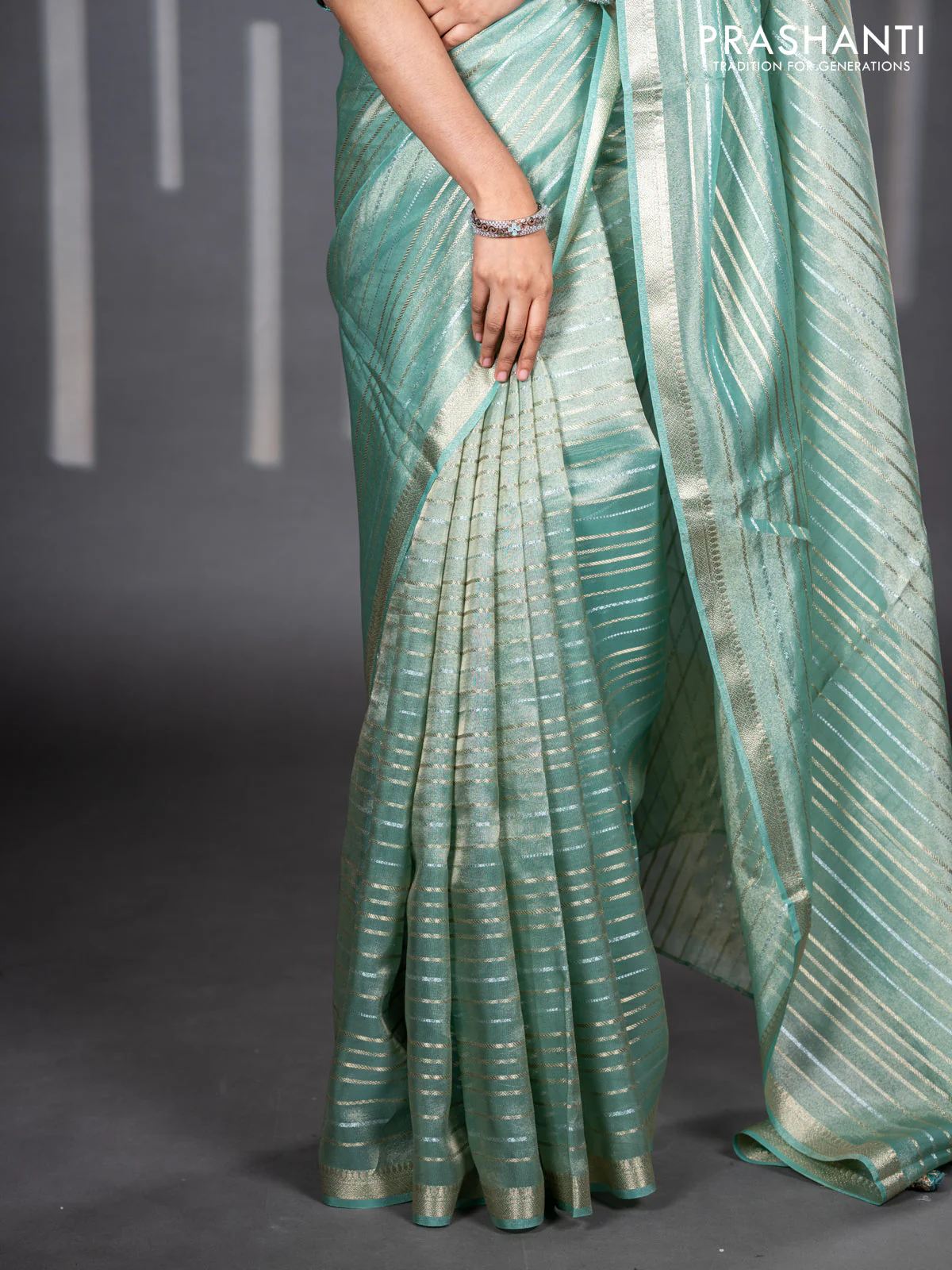 Tissue silk saree teal shade with allover silver & zari weaves and zari woven border - Image 5