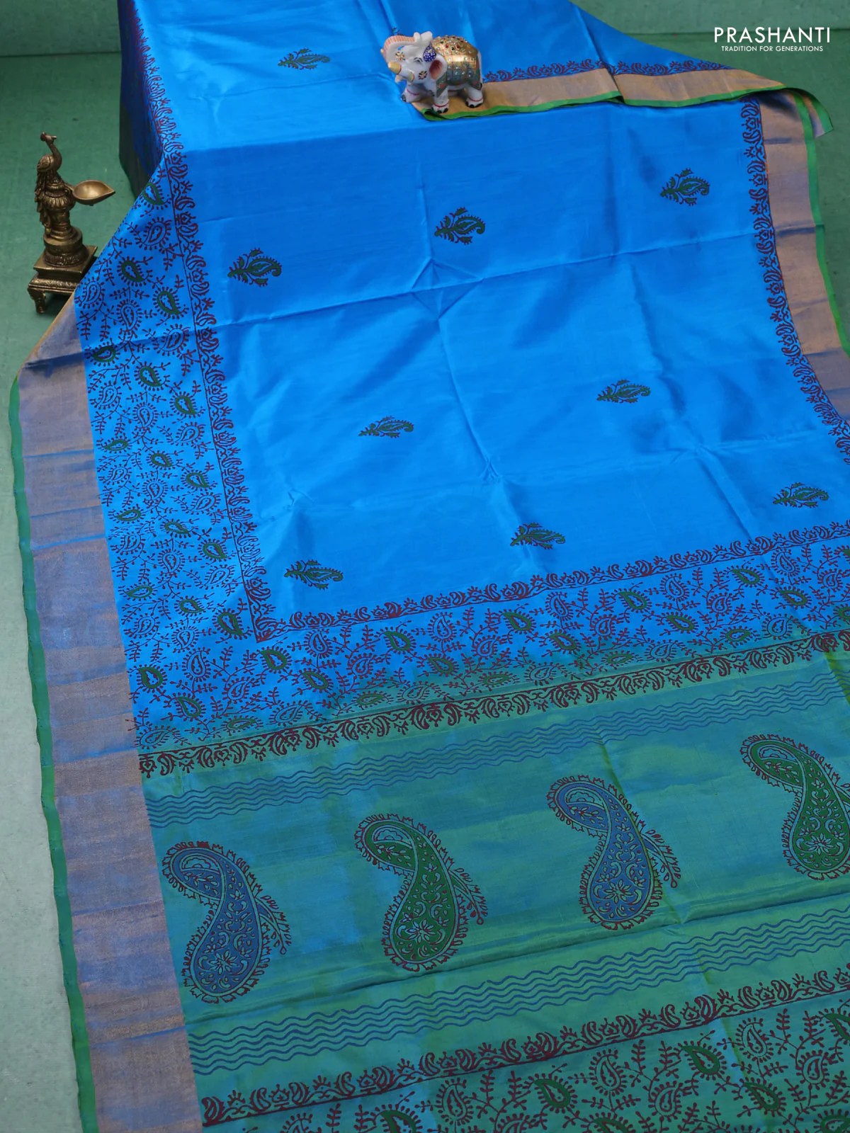 Uppada block printed silk saree cs blue and light green with paisly prints and zari woven border - Image 2