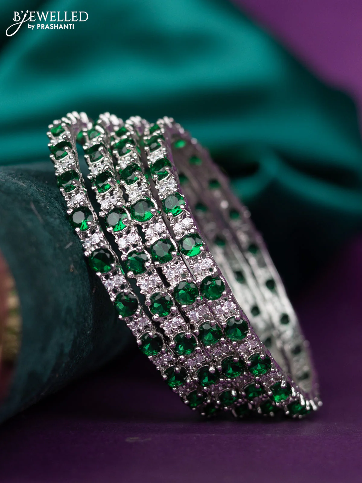 zircon bangle with emerald and cz stones