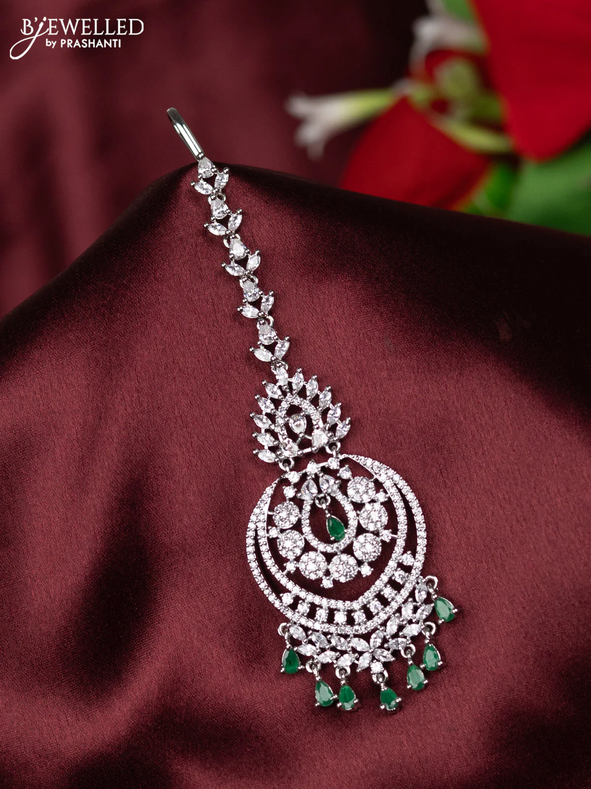 Zircon maang tikka with emerald & cz stones and hangings