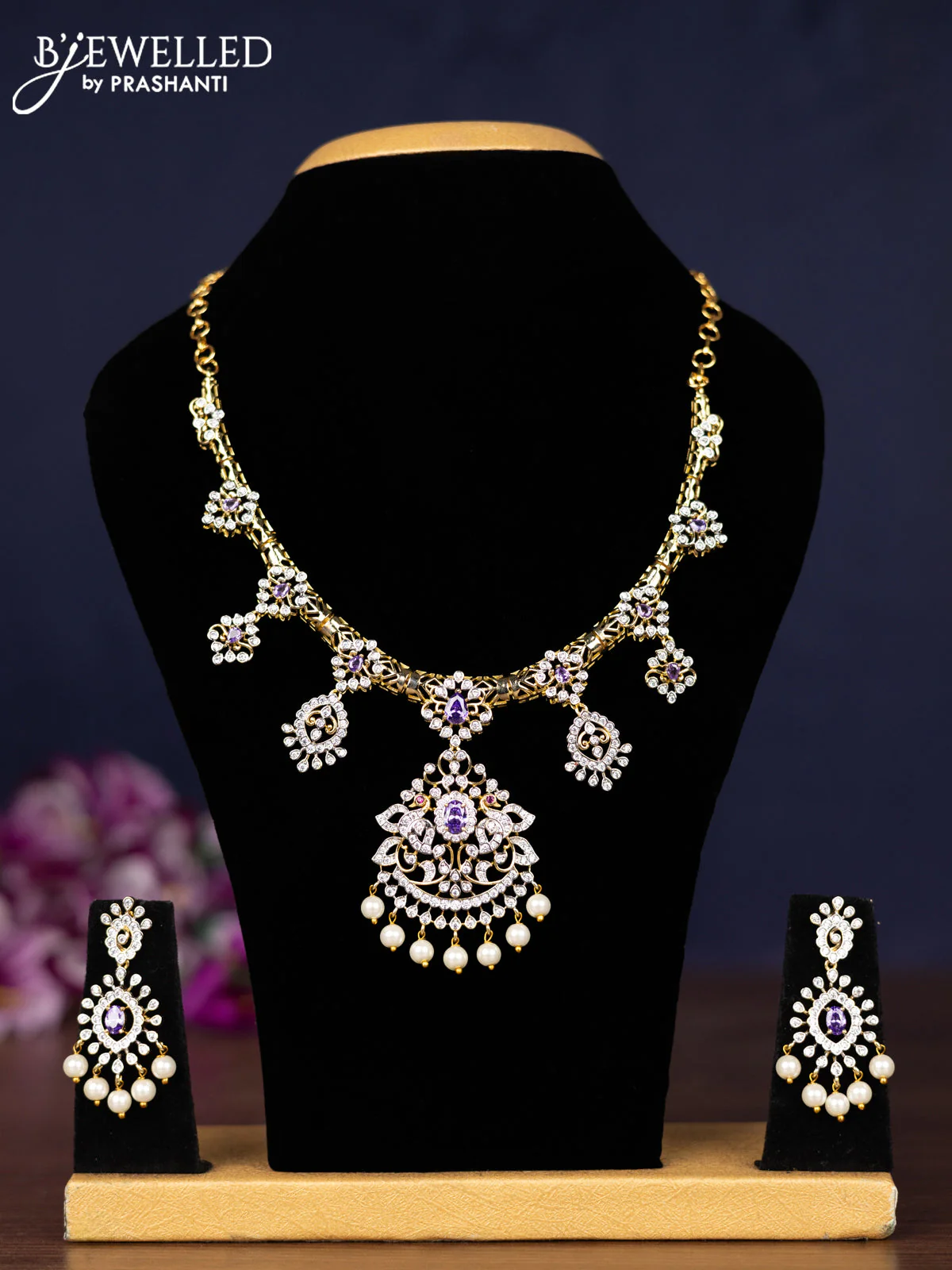 Zircon necklace with violet & cz stones and pearl hangings in gold finish